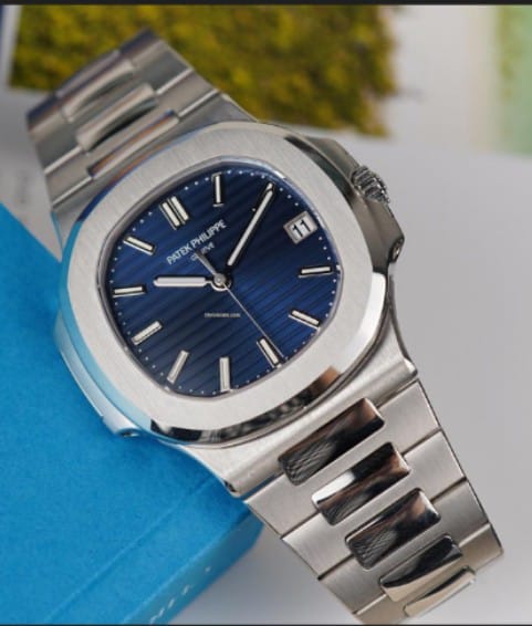 Patek Philippe Nautilus Designed for Man  specifically a stainless steel model with a blue dial