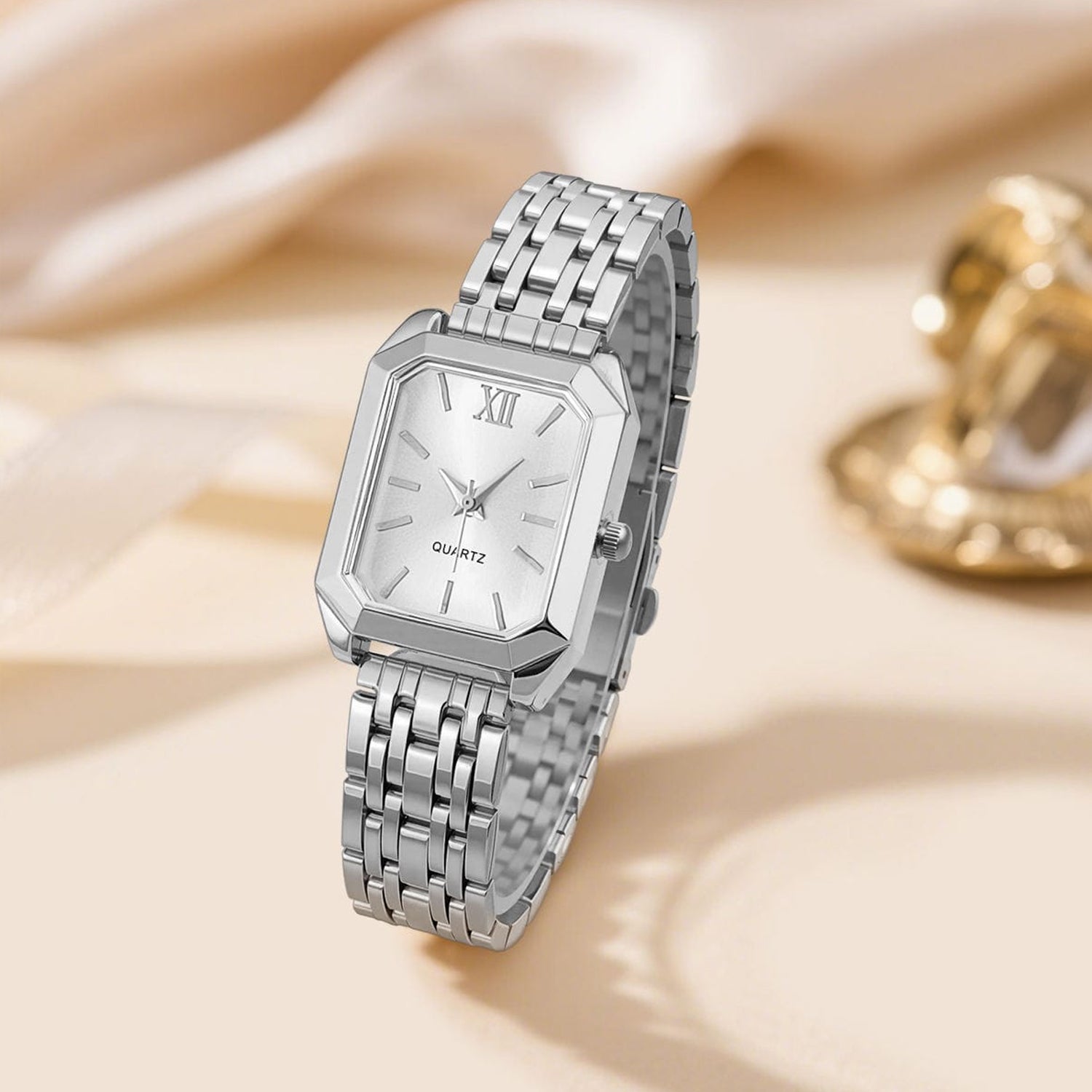 fashionable luxury quartz wristwatch designed for women, featuring a distinctive square case and a sleek silver-tone metal alloy strap.