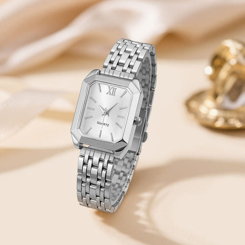 fashionable luxury quartz wristwatch designed for women, featuring a distinctive square case and a sleek silver-tone metal alloy strap.