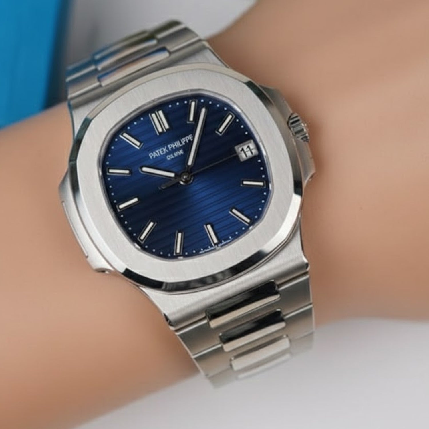 Patek Philippe Nautilus Designed for Man  specifically a stainless steel model with a blue dial